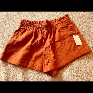 Brand new rust shorts with pockets, elastic waist & draw string